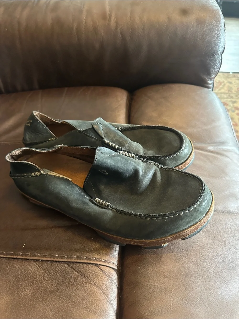 OluKai Men's Black Slip-On Loafers with Brown Trim